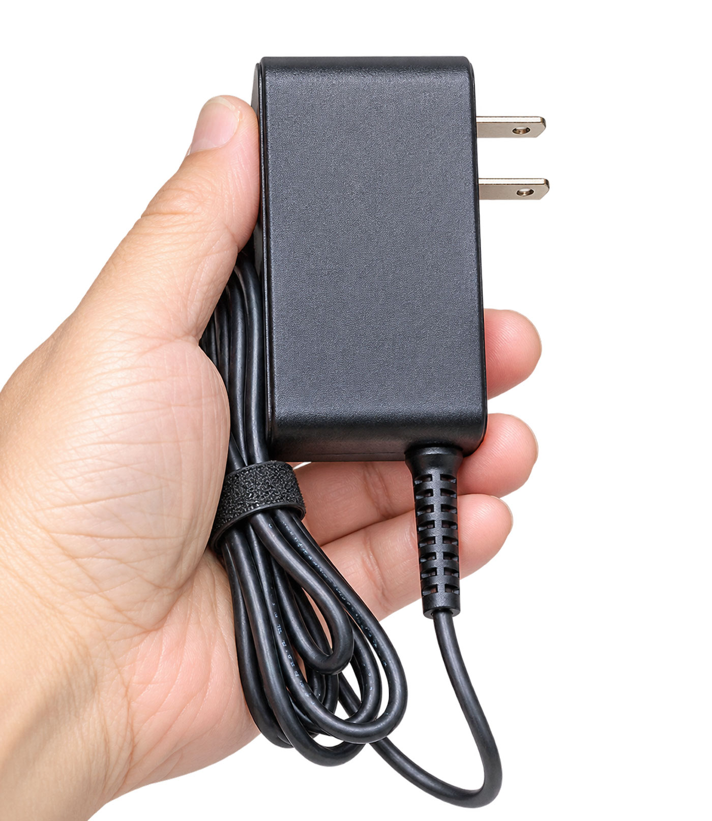 BiXPower compact 24V 2A AC DC power adapter held in hand demonstrating its small lightweight size