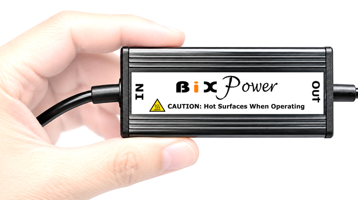 Compact BiXPower BX-DD100PD 100W USB-C PD converter shown in hand